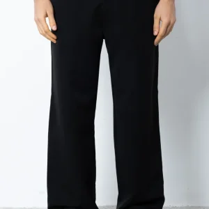 Pantalone abbottonatura e pences fondo ampio