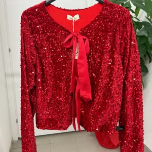 Giacca in velluto con paillettes con chiusura a fiocchi