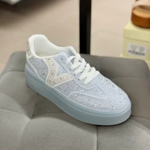 Sneakers brillantinati con platform alta