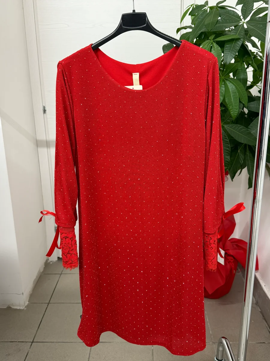 Abito brillantinato con fiocco e pizzo sulle maniche