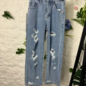 Jeans baggy chiari in denim con strappi 8-16 anni